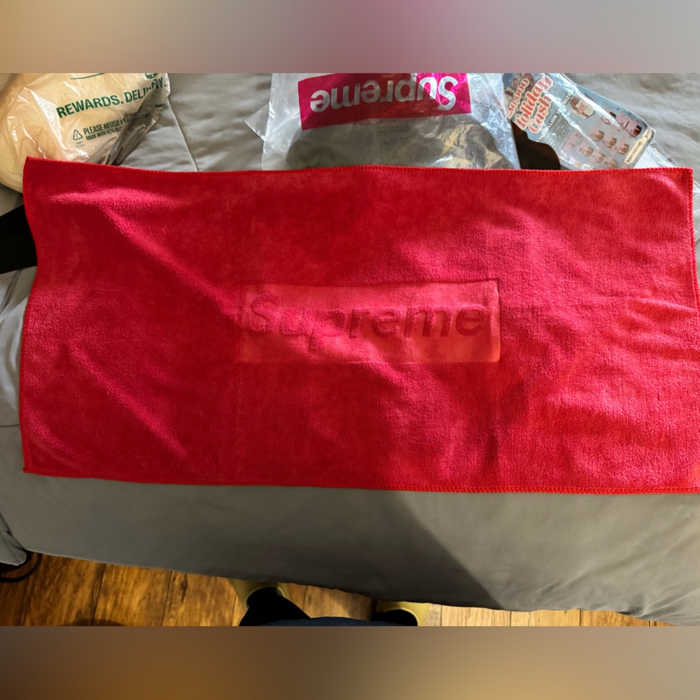 Supreme Red towel. NWOT. 12x28”.